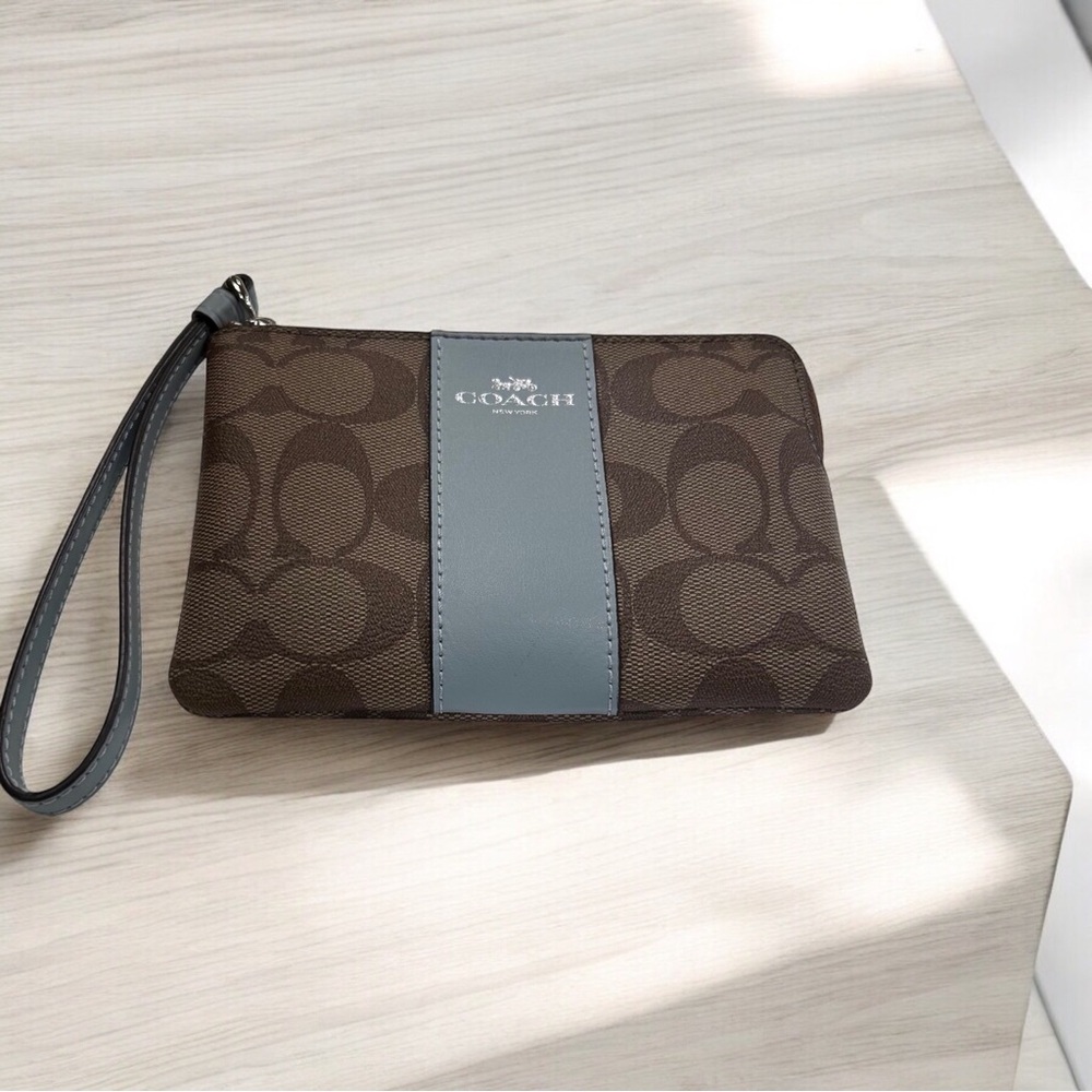 Coach NWT corner zip wristlet in signature canvas Khaki/Pale blue.